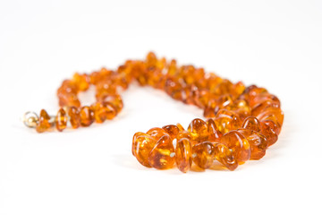 Amber necklace on white background