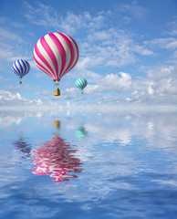 Obraz premium 3d balloons in the blue sky and reflection in water