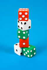 Stack of gaming dice on blue background