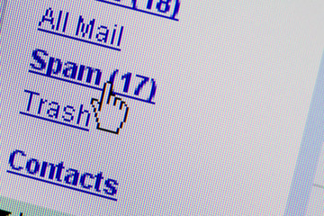 Monitor showing email spam mailbox folder. advertising concept