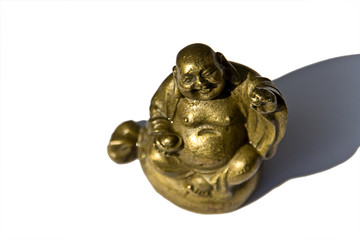 Golden Buddha holding an apple in the sun and having fun!