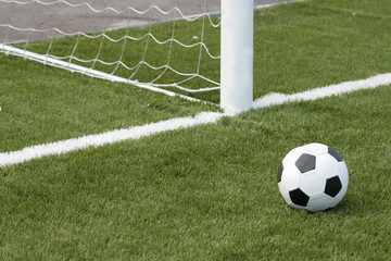football lays on an artificial covering of stadium
