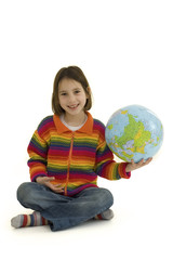 young girl holding the world globe isolated on white