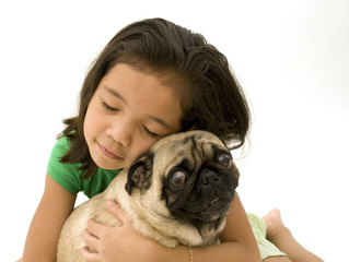 Child Hugging Pet