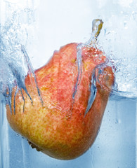 splashing pear into a water