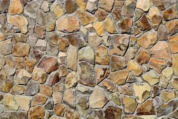New colorful wall with stones of different shapes and sizes.