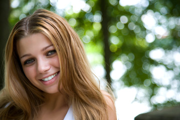 Portrait of young girl on forest background