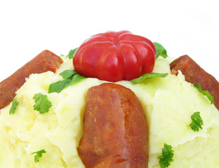 Mashed potatoes, sausages, parsley and paprika
