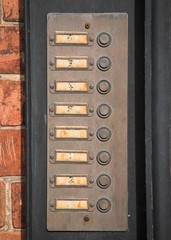 Row of numbered door bell buttons
