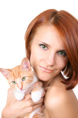 beautiful redhead girl with red fluffy kitten