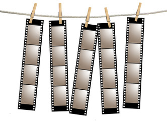 Fototapeta premium Blank 35mm Film Strip Negatives Hanging From A Rope