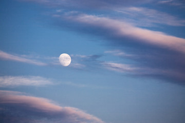 Nighttime sky with moon and clouds. Ideal for background..