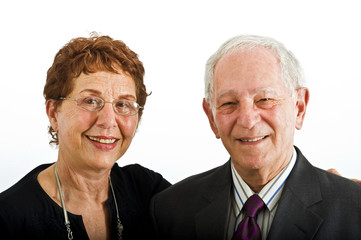 closeup senior couple smiling isolated on white