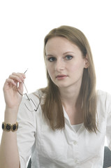 brunette working at various tasks in her office