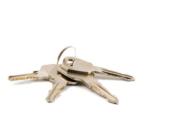 A bunch of keys isolated against a clean white background..