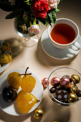 Cup of tea and sweet on a table