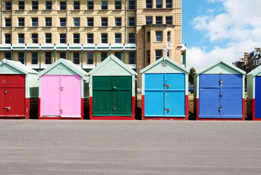 A photography of colorful houses at the beach in Brighton