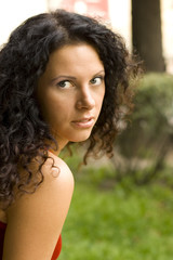 Naklejka premium outdoor portrait of beautiful brunet woman in red