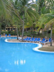 blue pool in a tropical setting