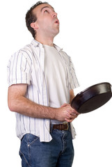 A man with a frying pan, flipping food into the air