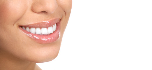 Obraz premium Beautiful young woman teeth. Isolated over white background.