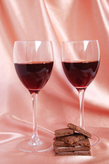Two glasses with red wine and  chocolate
