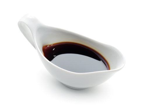 Soy Sauce in Suace-boat. Isolated over White