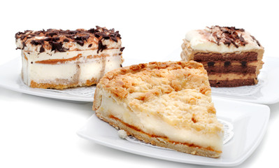 Cheesecakes on a Plates. Isolated on White Background
