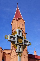 Tower church in gothic stiletto and cross