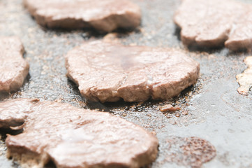 chunks of beef tenderloin being prepared on a hot stone