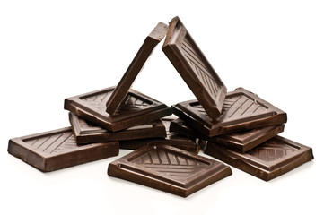 Chocolate pieces arranged like home isolated on white