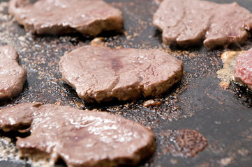 meat cooking in a hot stone