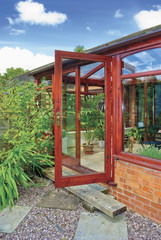 conservatory tables chairs plants room in house next to garden