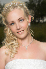 Beautiful Blond bride wearing diamond jewelery