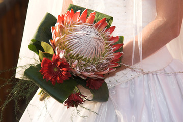 Wedding Bouquet with red flowers and a big protea