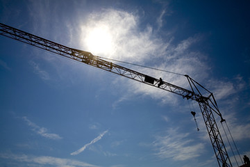 a couple of cranes on a construction site