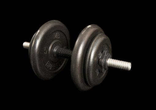 Heavy man dumbbells on black isolated background