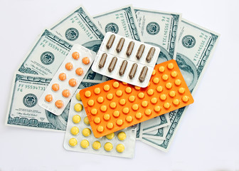 Many medicine  pills with money