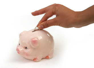 Girl add wedding ring to pink pig