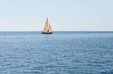 lonely sailing vessel on sea surface
