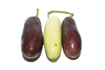 Two purple aubergines and marrow isolated on white.
