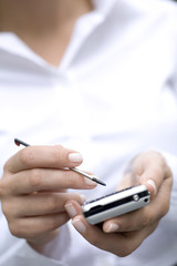 Fototapeta premium Woman using palmtop, close-up
