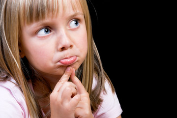 Naklejka premium Blond Girl with big blue eyes on a black background