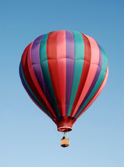 Colorful hot air balloon floating in blue sky