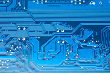 Close up of computer circuit board in blue