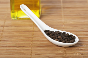 Peppercorns with soft shadow in the background. Shallow DOF