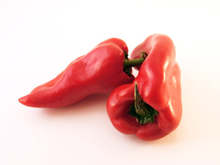 Two isolated red paprikas
