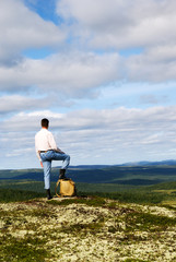 traveler on top of montain of north tundra