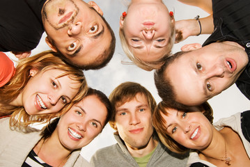 Group of happy friends making funny faces