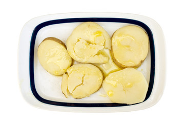 a tray of healthy boiled potatoes with olive oil